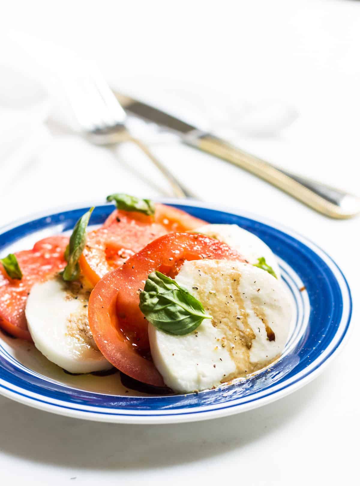 Tomato Mozzarella Salad with fresh basil! Recipe via MonPetitFour.com