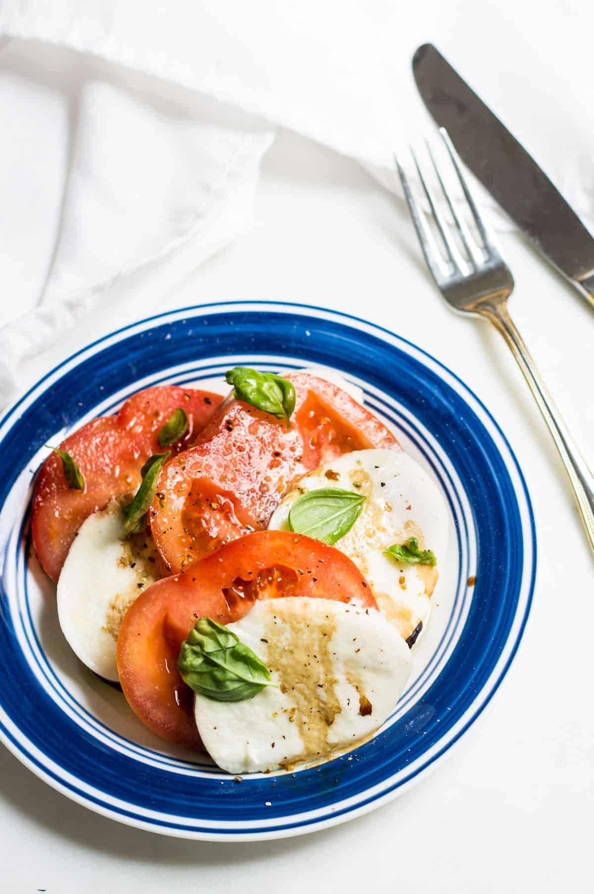 Tomato Mozzarella Salad with fresh basil! Recipe via MonPetitFour.com