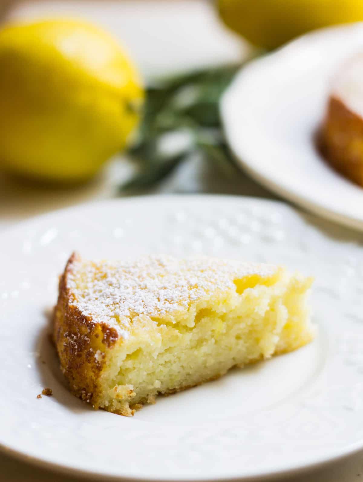 lemon ricotta cake close up image of slice on a plate