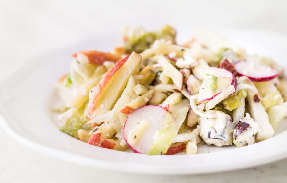 Apple Fennel Salad: a fall salad made with apples, fennel, Belgian endive, radishes, and a blue cheese vinaigrette. Easy, light, and delicious! French recipe via MonPetitFour.com