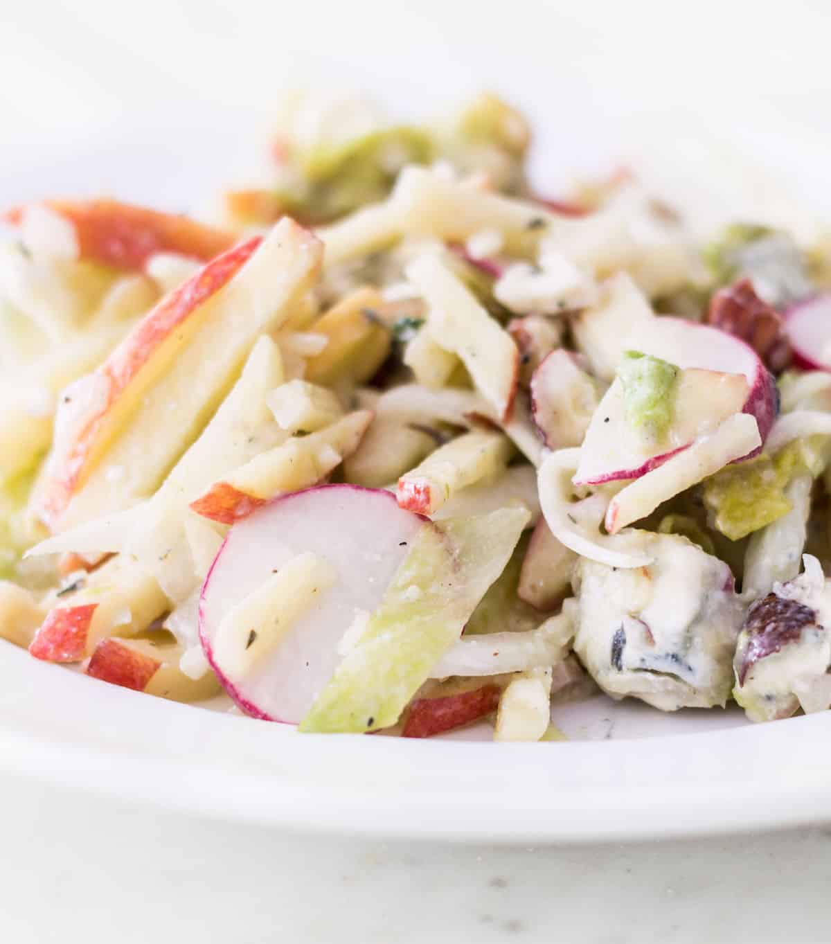 Apple Fennel Salad: a fall salad made with apples, fennel, Belgian endive, radishes, and a blue cheese vinaigrette. Easy, light, and delicious! French recipe via MonPetitFour.com