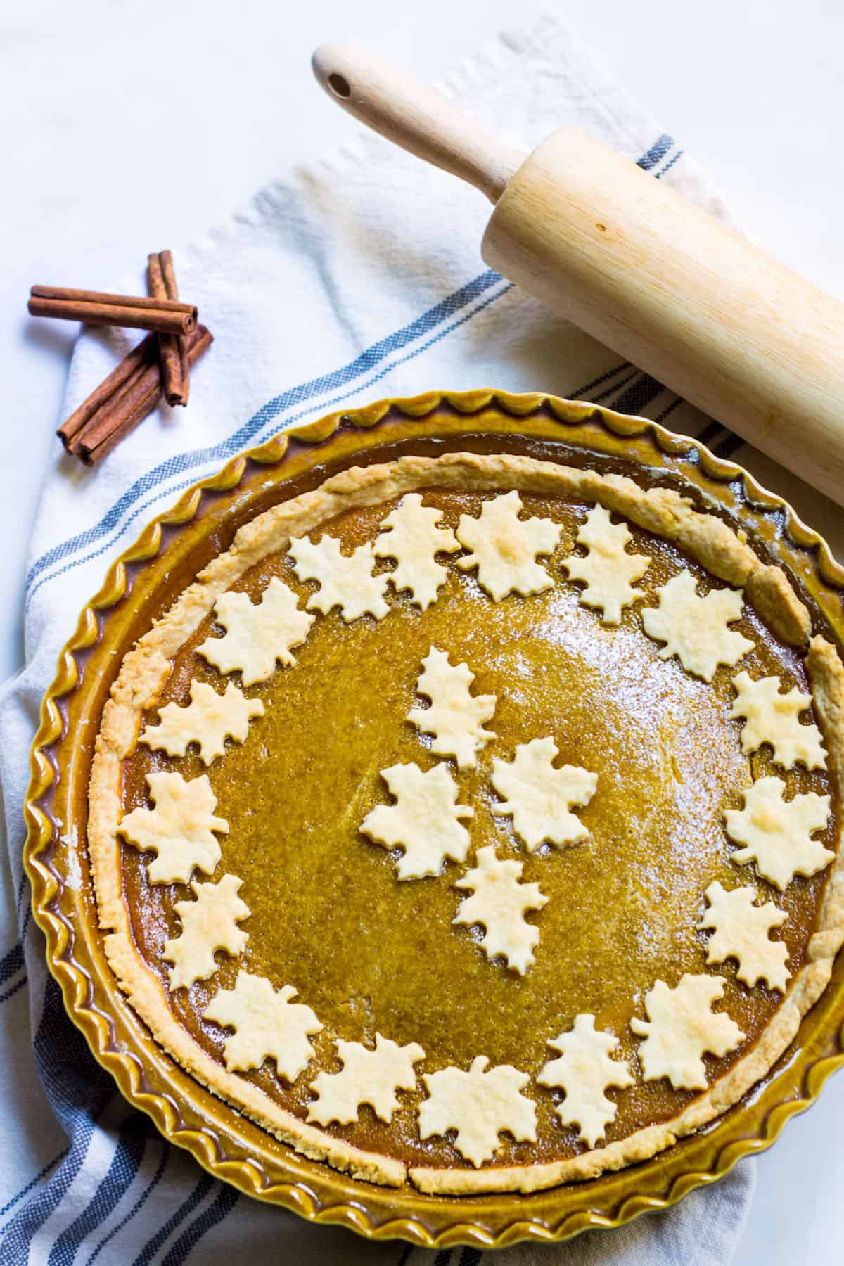 Homemade Pumpkin Pie recipe in a pie dish with fall design on top