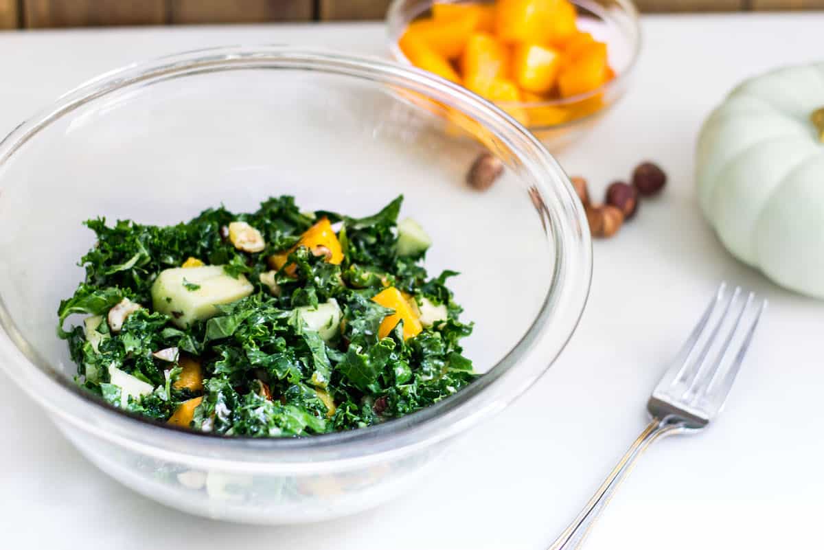 Kale Butternut Squash Salad: an easy fall salad with a tasty maple vinaigrette. Perfect for the holidays too! Recipe via MonPetitFour.com
