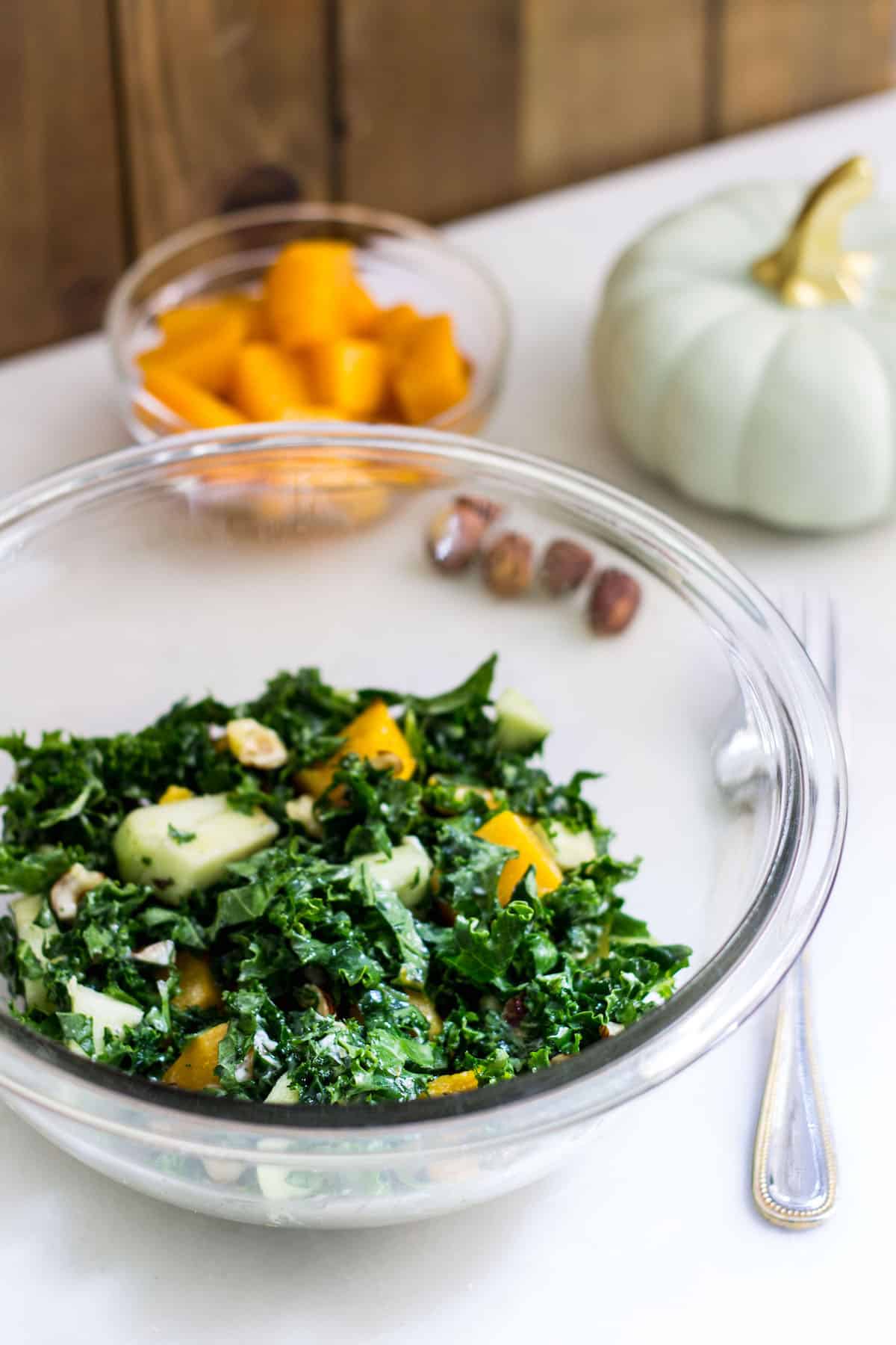 Kale Butternut Squash Salad: an easy fall salad with a tasty maple vinaigrette. Perfect for the holidays too! Recipe via MonPetitFour.com