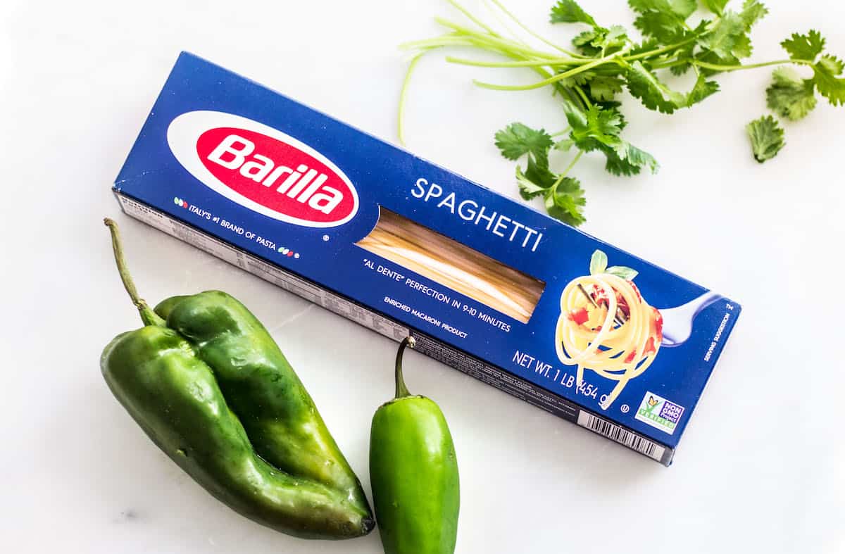 Pasta Poblano: a creamy pasta recipe made with poblano chiles, jalapeño, cilantro, and fresh crema sauce. Tasty, quick, and easy weeknight dinner! Recipe via MonPetitFour.com