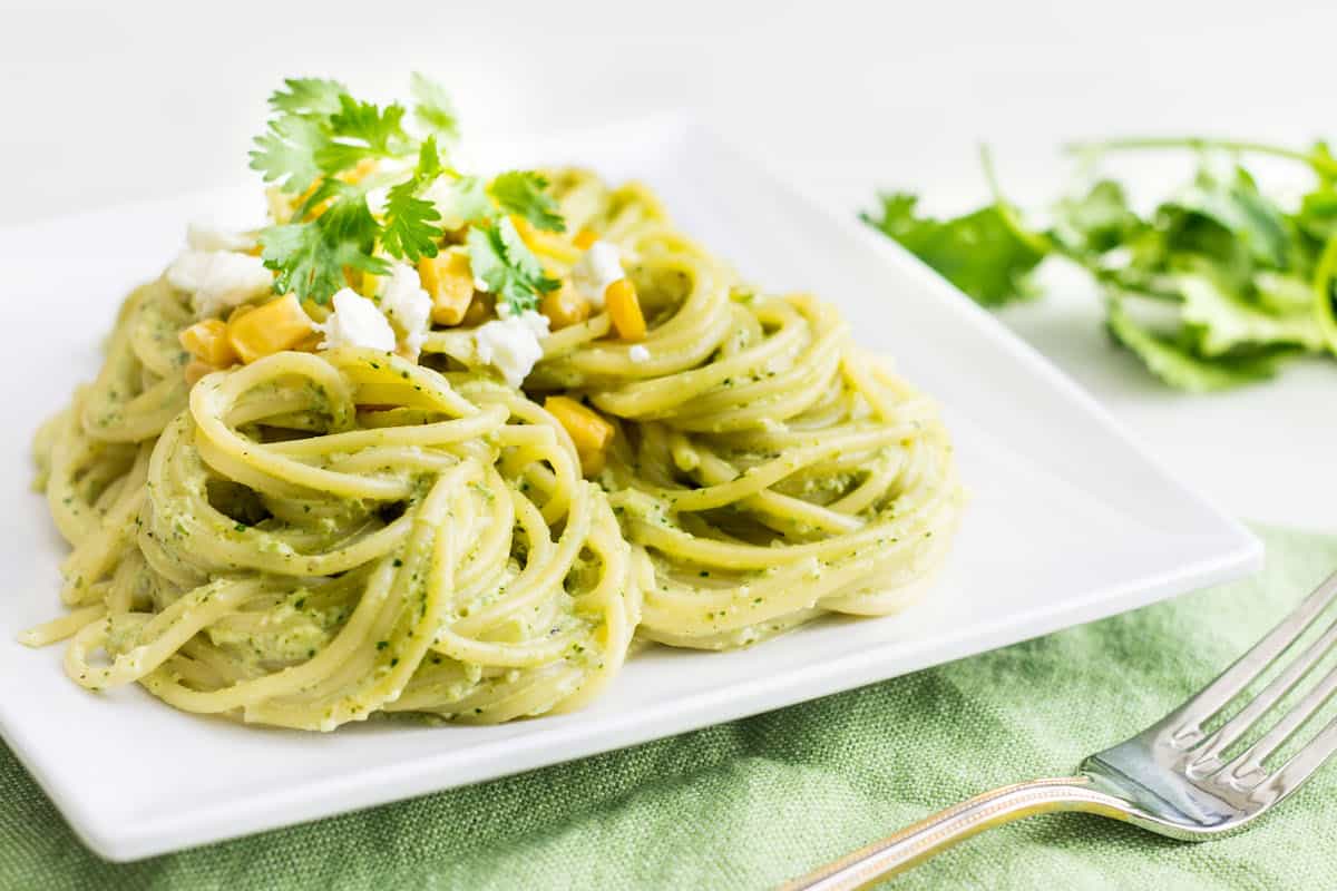 Pasta Poblano: a creamy pasta recipe made with poblano chiles, jalapeño, cilantro, and fresh crema sauce. Tasty, quick, and easy weeknight dinner! Recipe via MonPetitFour.com