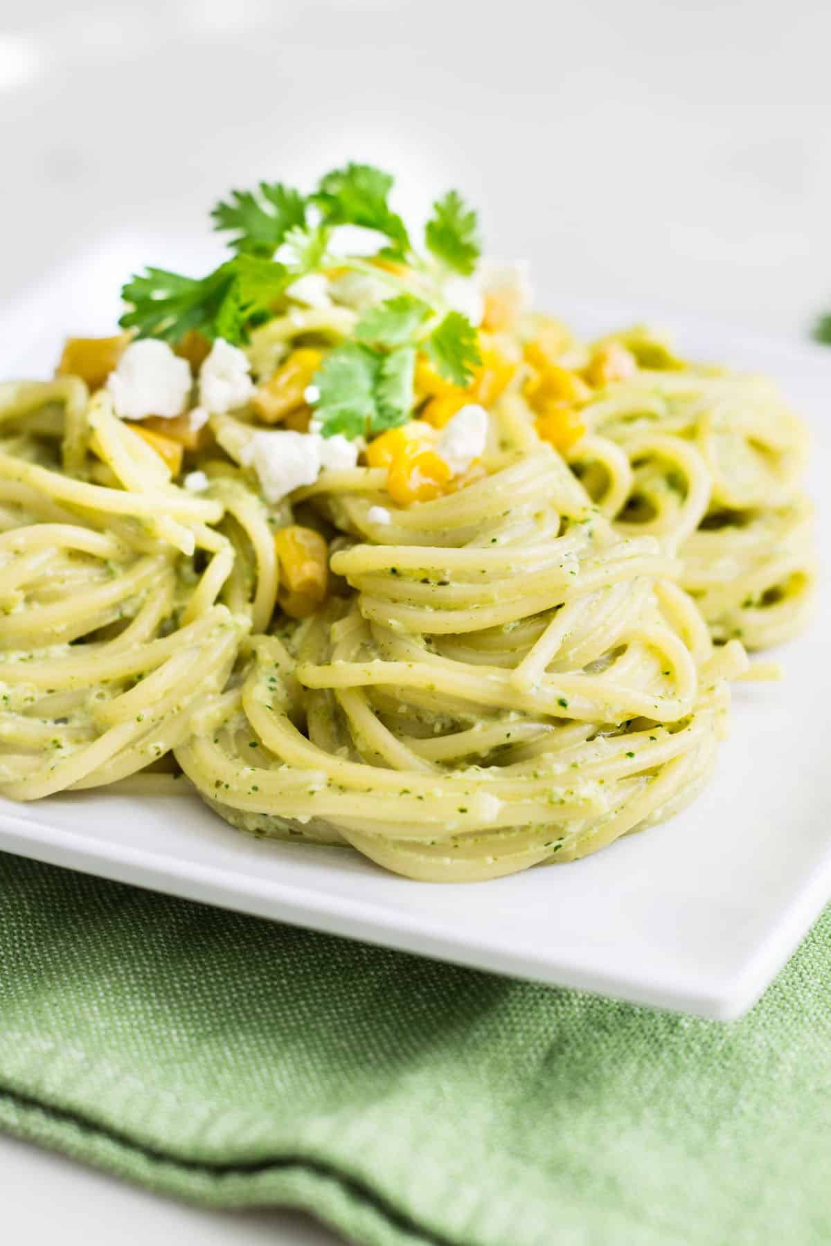 Pasta Poblano: a creamy pasta recipe made with poblano chiles, jalapeño, cilantro, and fresh crema sauce. Tasty, quick, and easy weeknight dinner! Recipe via MonPetitFour.com