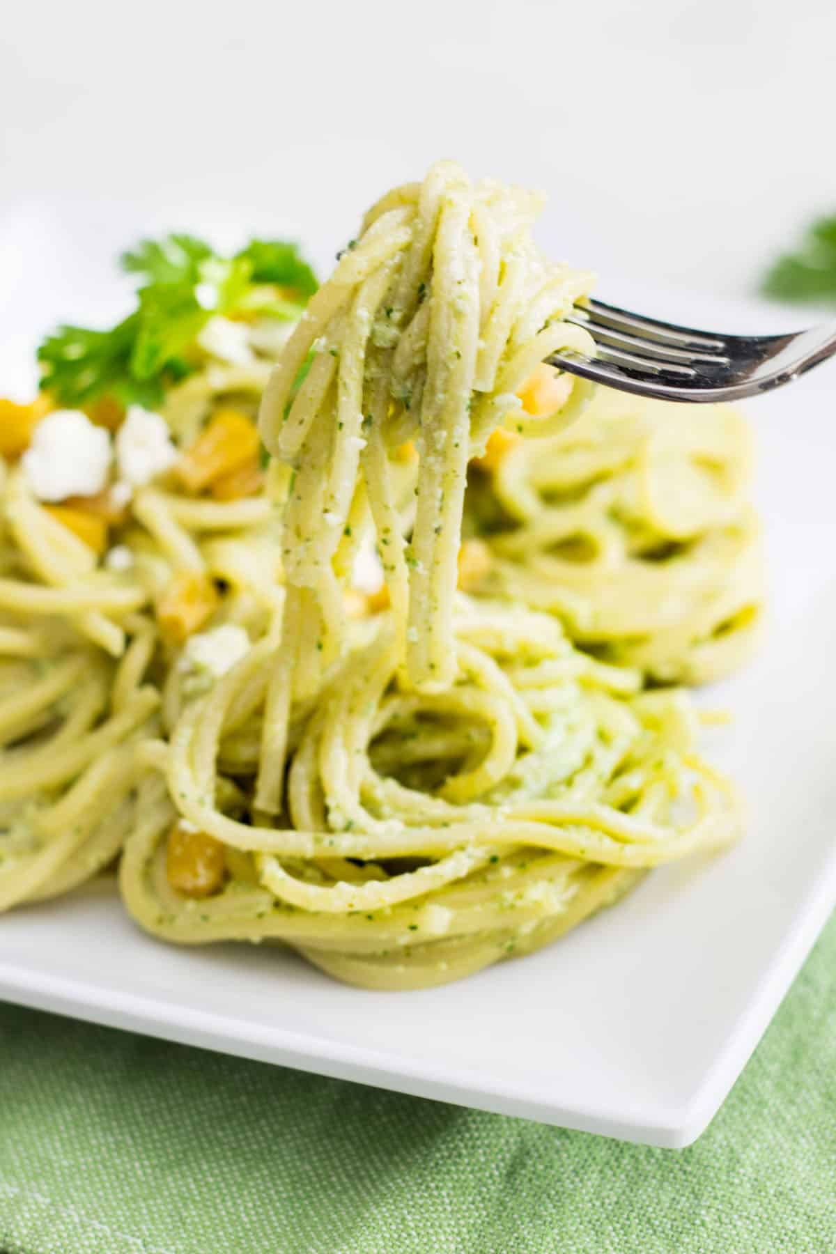 Pasta Poblano: a creamy pasta recipe made with poblano chiles, jalapeño, cilantro, and fresh crema sauce. Tasty, quick, and easy weeknight dinner! Recipe via MonPetitFour.com