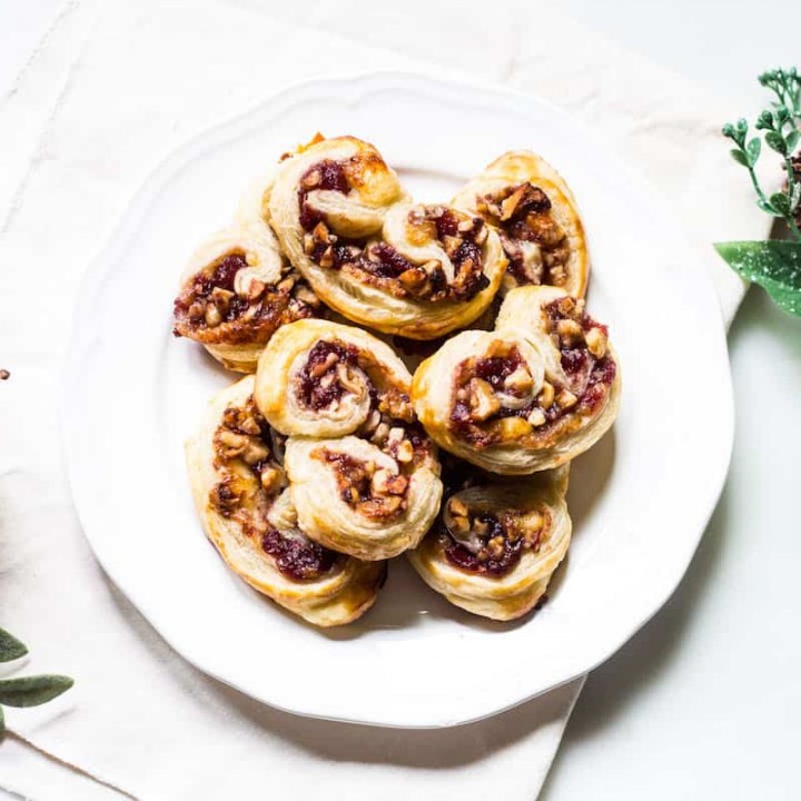 Savory Palmiers made with brie, walnuts, cranberry jelly, and Pepperidge Farm® Puff Pastry Sheets. A crowd-pleasing appetizer for any occasion or holiday! French recipe via MonPetitFour.com #ad #InspiredbyPuff