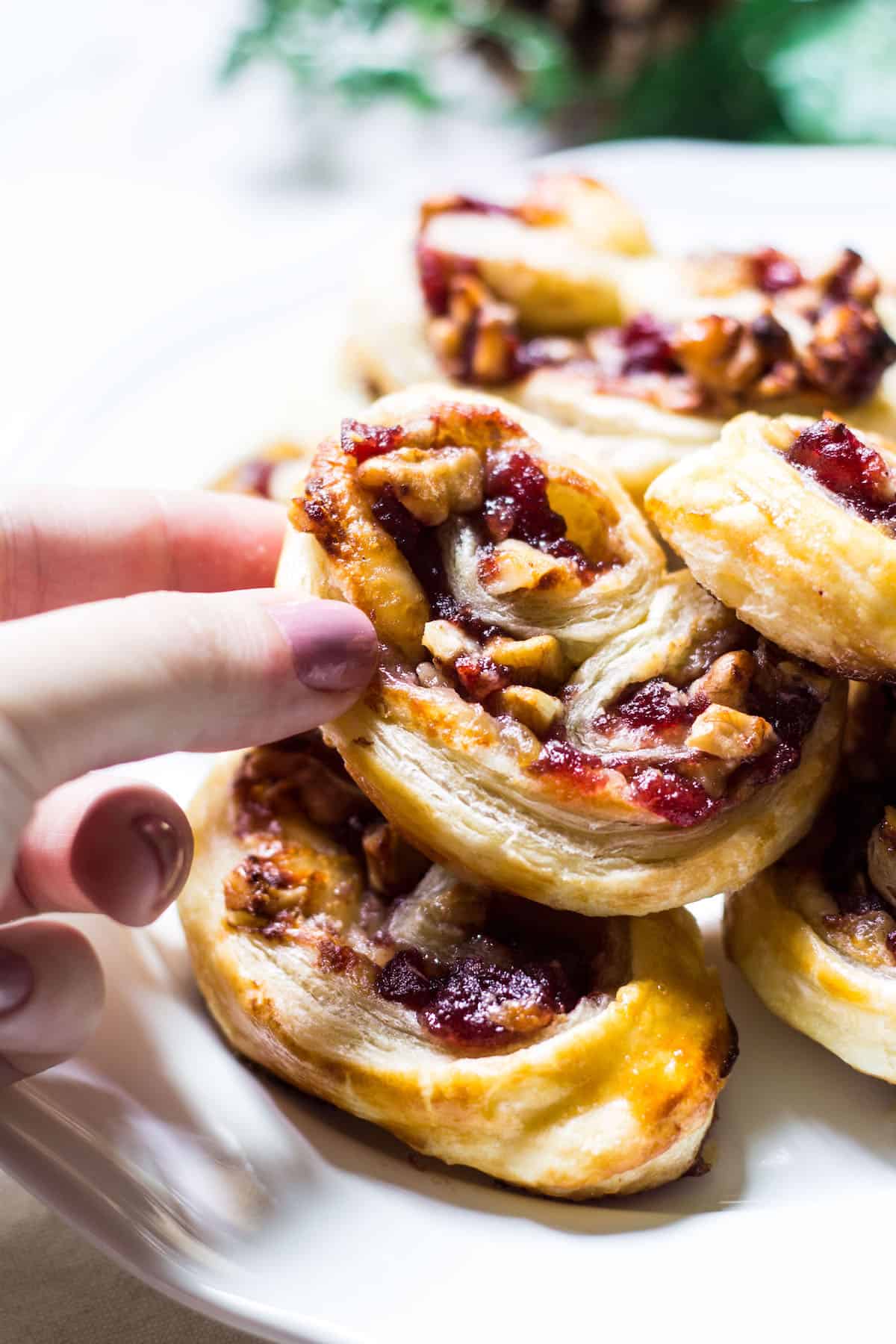 Savory Palmiers made with brie, walnuts, cranberry jelly, and Pepperidge Farm® Puff Pastry Sheets. A crowd-pleasing appetizer for any occasion or holiday! French recipe via MonPetitFour.com #ad #InspiredbyPuff