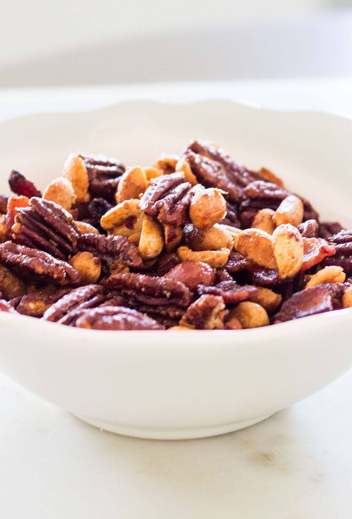 Rosemary Spiced Nuts: a recipe for slightly spiced, sweet and roasted cocktail nuts. French recipes via MonPetitFour.com