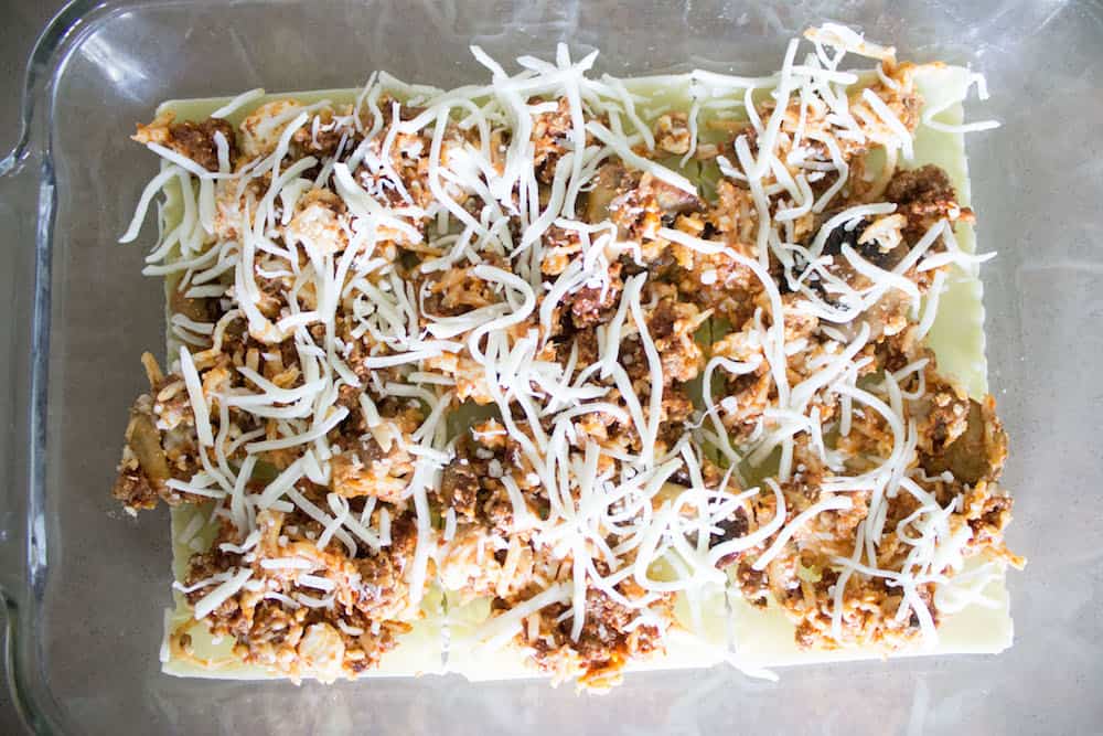 Easy beef Lasagna filling topped with cheese via Mon Petit Four