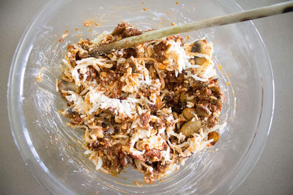 Easy beef lasagna meat and cheese combined via Mon Petit Four