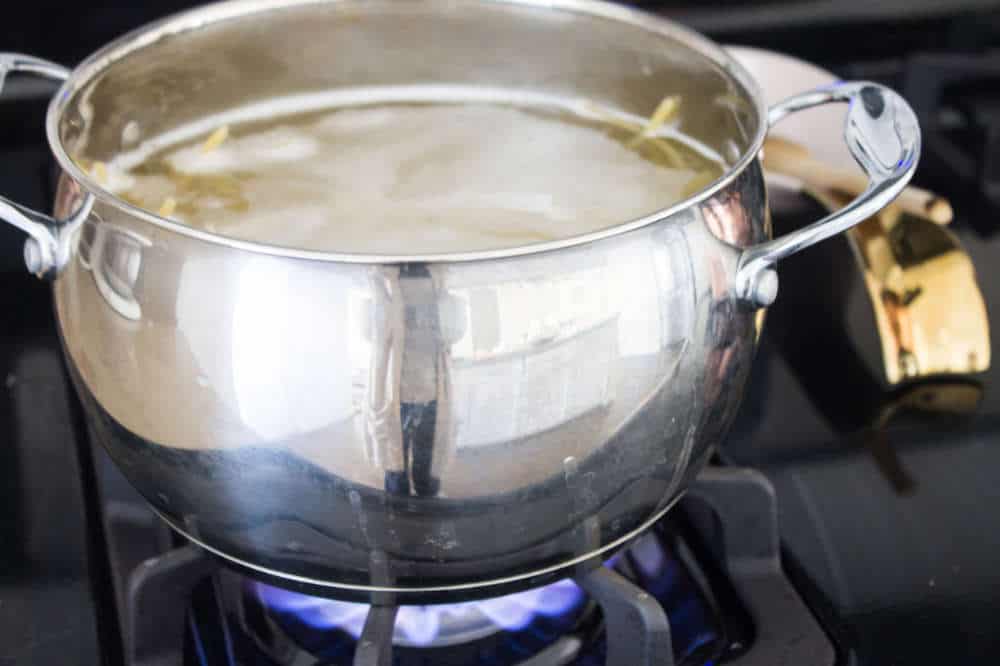 Simple Bolognese Recipe spaghetti cooking in pot