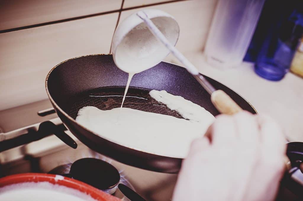 crepe batter in a pan