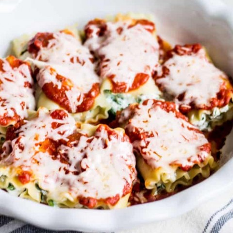 lasagna rolls arranged in a baking dish