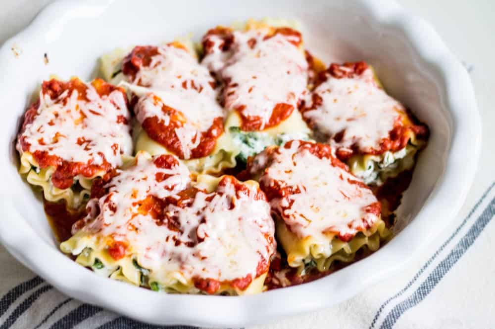 lasagna rolls arranged in a baking dish