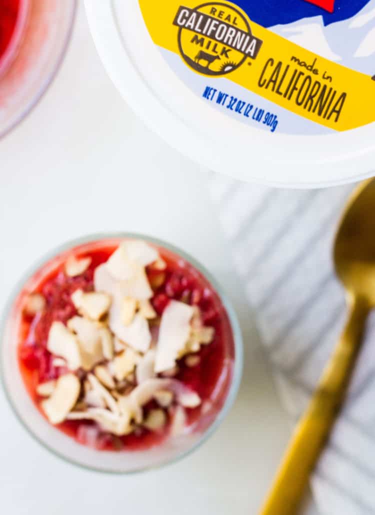 berry compote with Real california milk yogurt and coconut flakes and almond topping