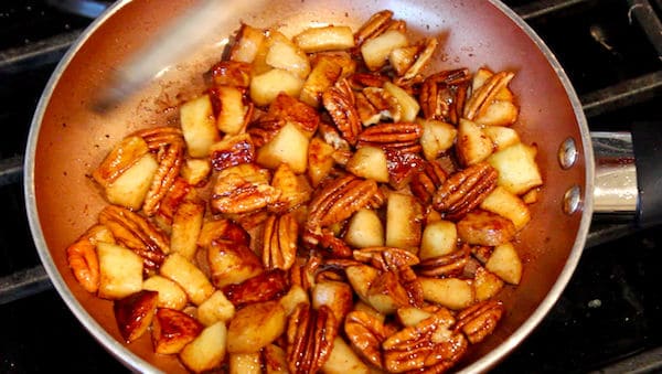 Apples and pecans cooked in butter and sugar