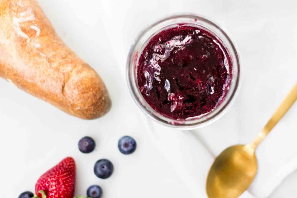 Mixed Berry Jam in a jar photographed from overhead