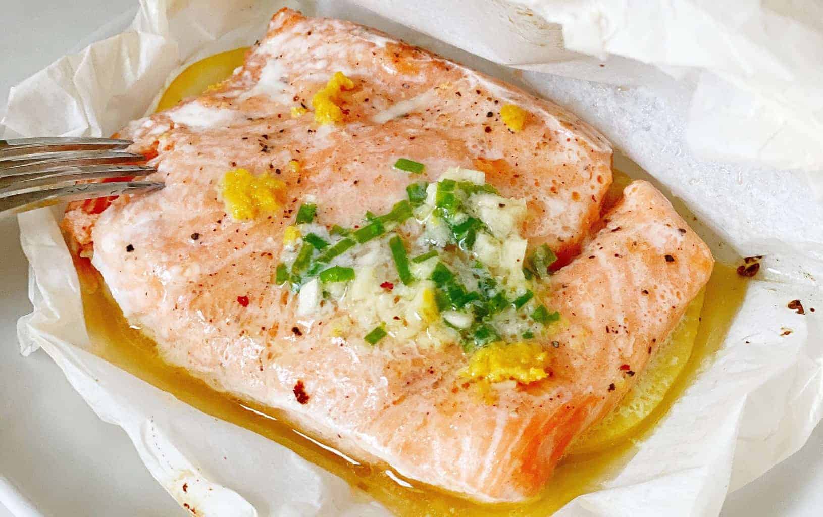 piece of salmon in parchment paper image