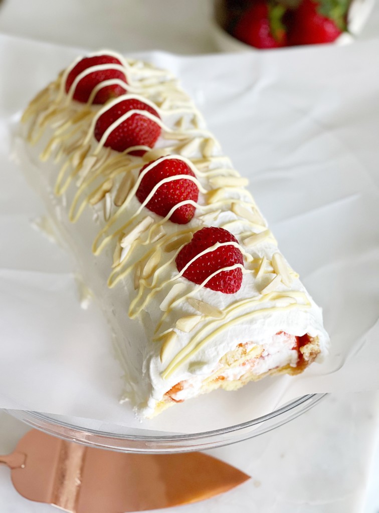 vanilla swiss roll cake with fresh strawberries image