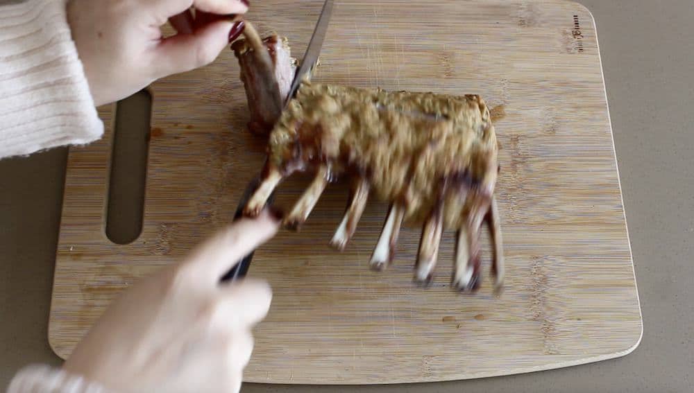 cutting a roast rack of lamb
