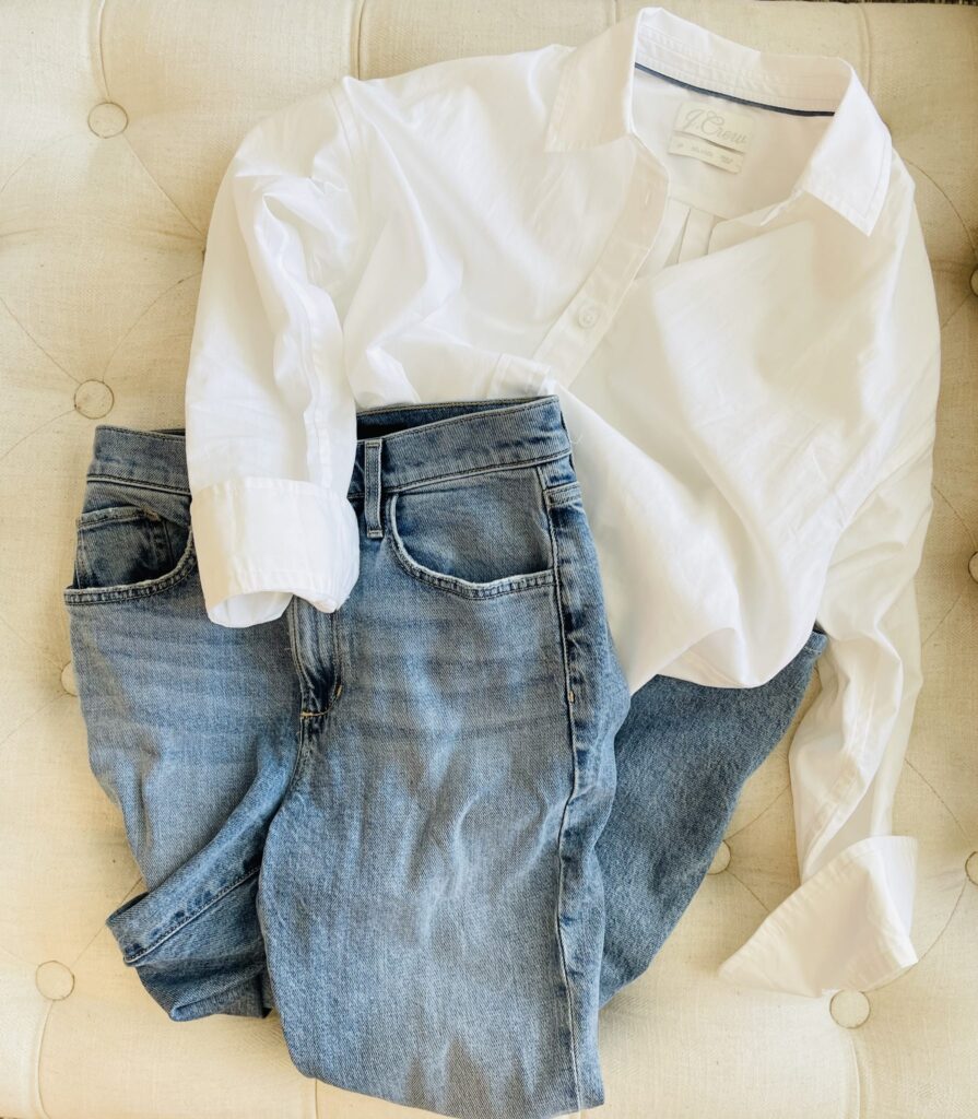 classic blue jeans and a white button down top image