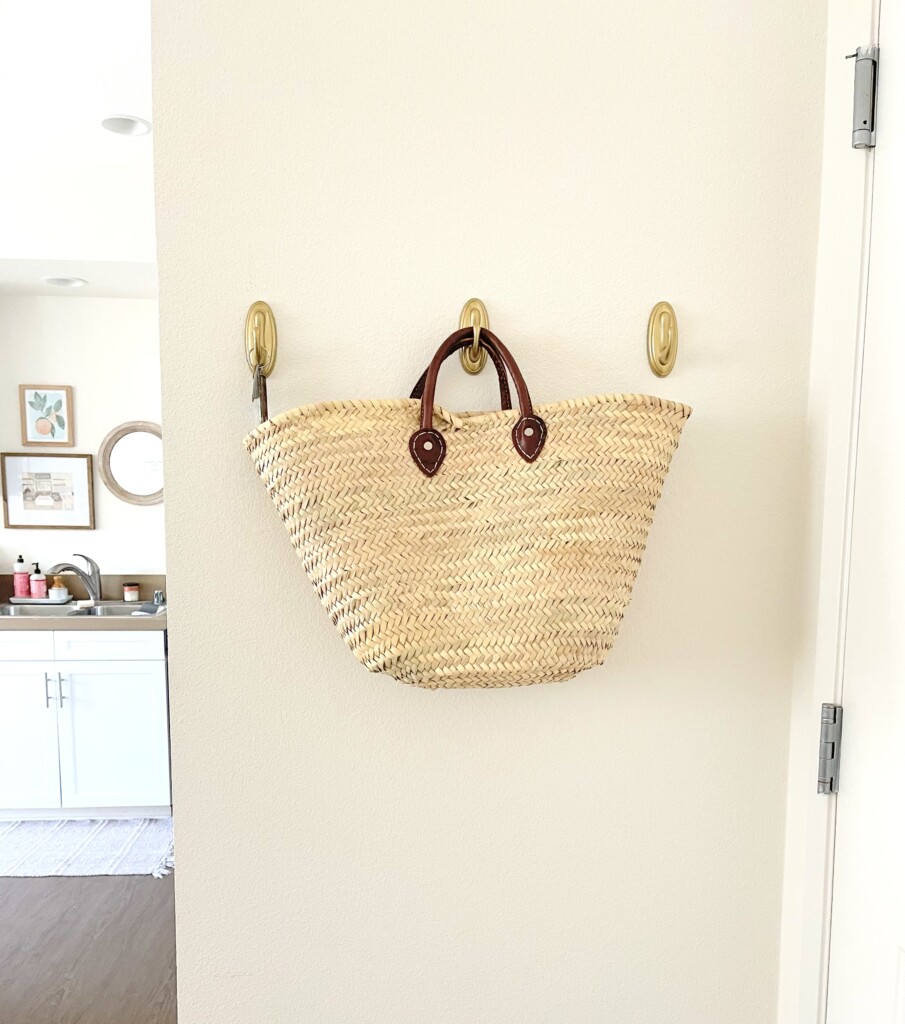 french market tote hanging on a wall hook