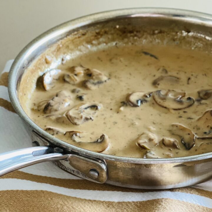 sauce forestiere recipe in a pan sitting on a kitchen towel
