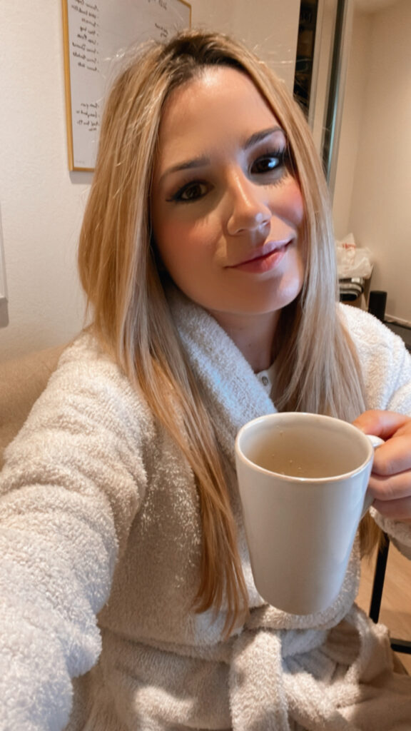 beeta holding a mug of coffee in the morning