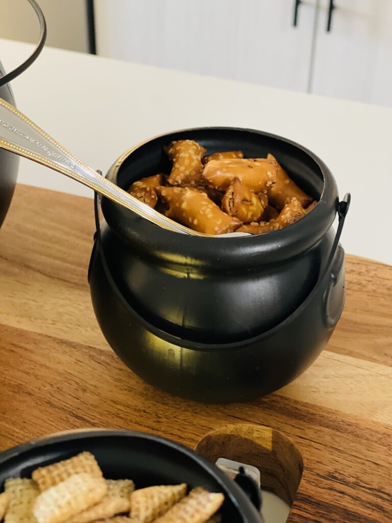 peanut butter stuffed pretzels in a mini plastic cauldron