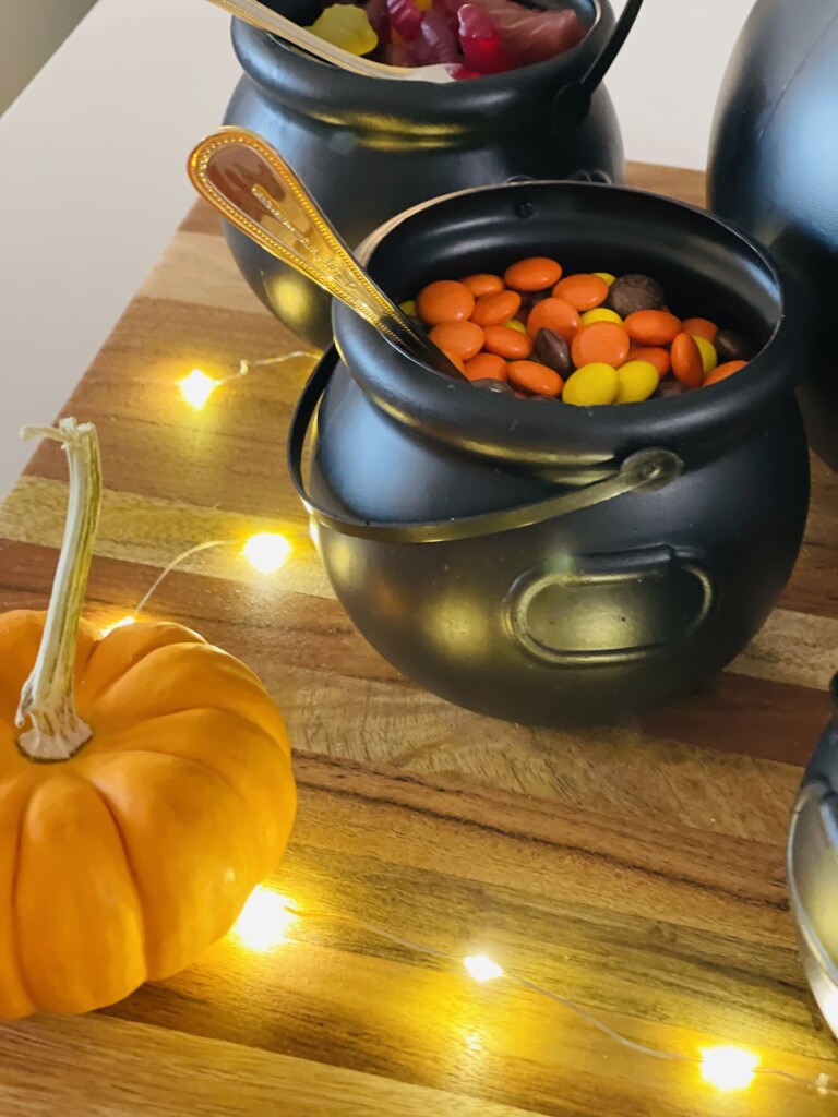 reese's pieces in a mini plastic cauldron