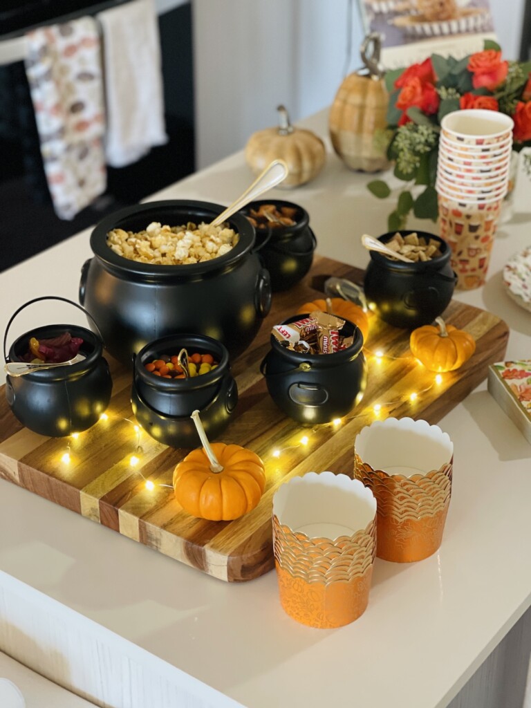 halloween popcorn bar display with mini fairy lights